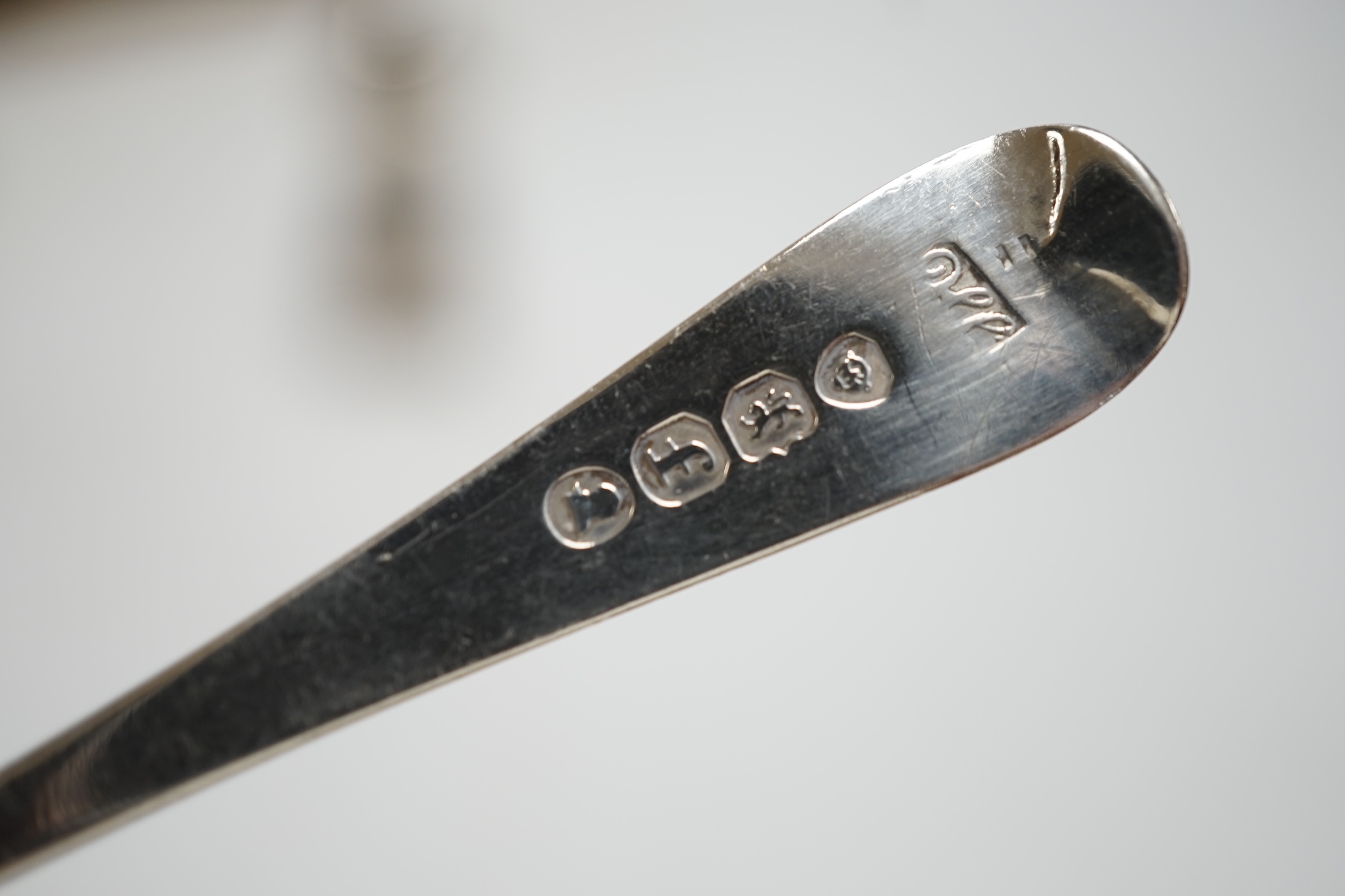 Two cased sets of six silver coffee spoons, a set of four silver condiments, two silver napkin rings, silver toastrack, etc.